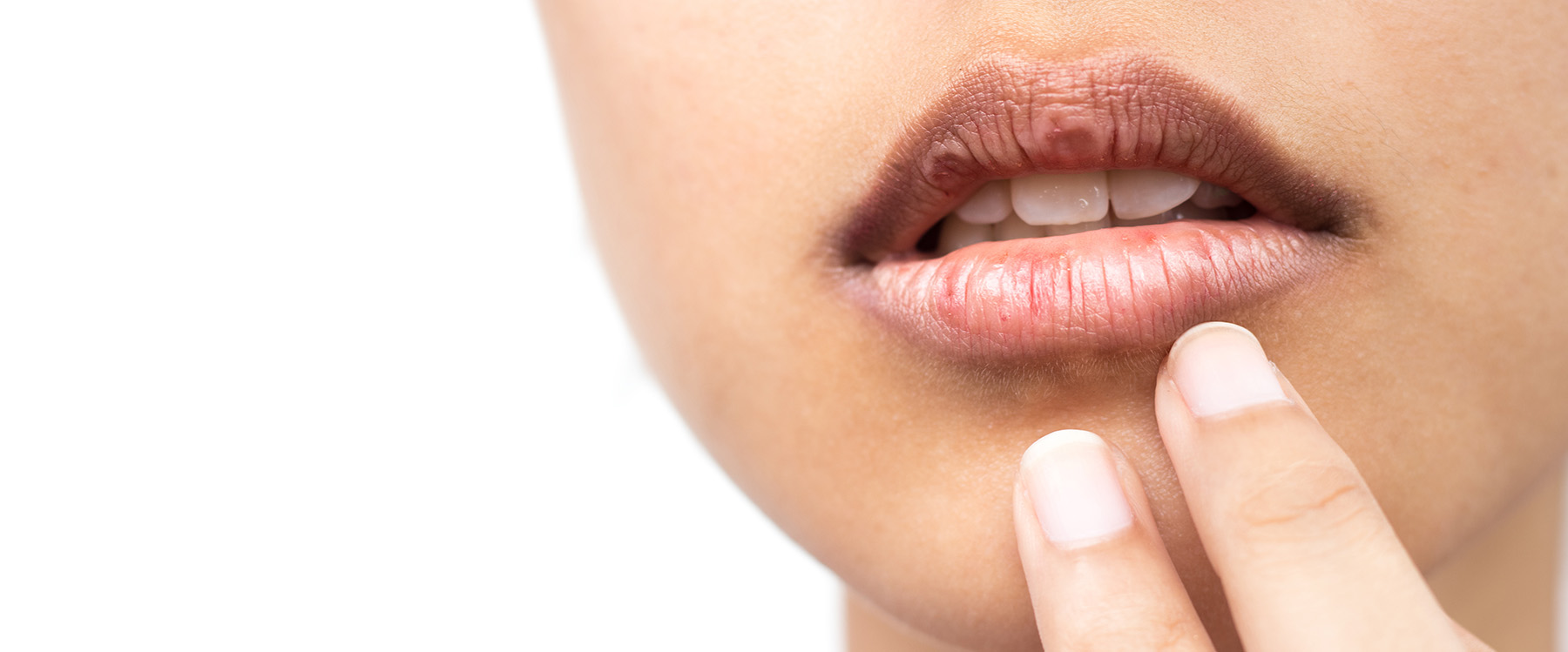 The image shows a close-up view of a person s face with their hand near their mouth, suggesting a contemplative or thoughtful expression.